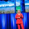 Caroline Kennedy speaking on stage about AI, business performance and transformation
